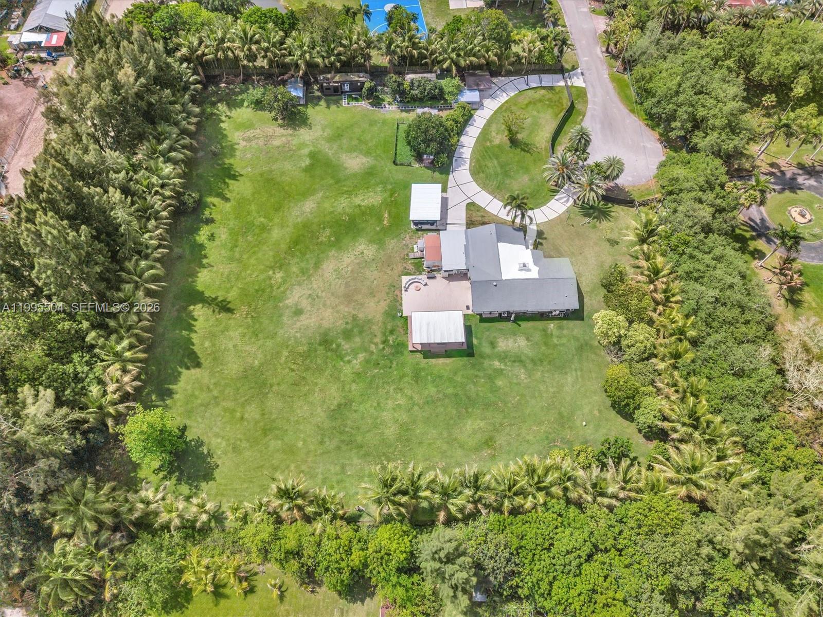 6920 Southwest 182nd Way Southwest Ranches, FL 33331 - Photo 58 of 61 a aerial view of a house with a garden and trees