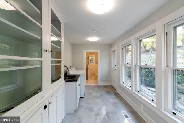 a view of a hallway with bathroom