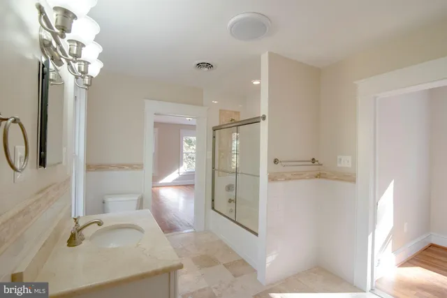 a bathroom with a bathtub and shower