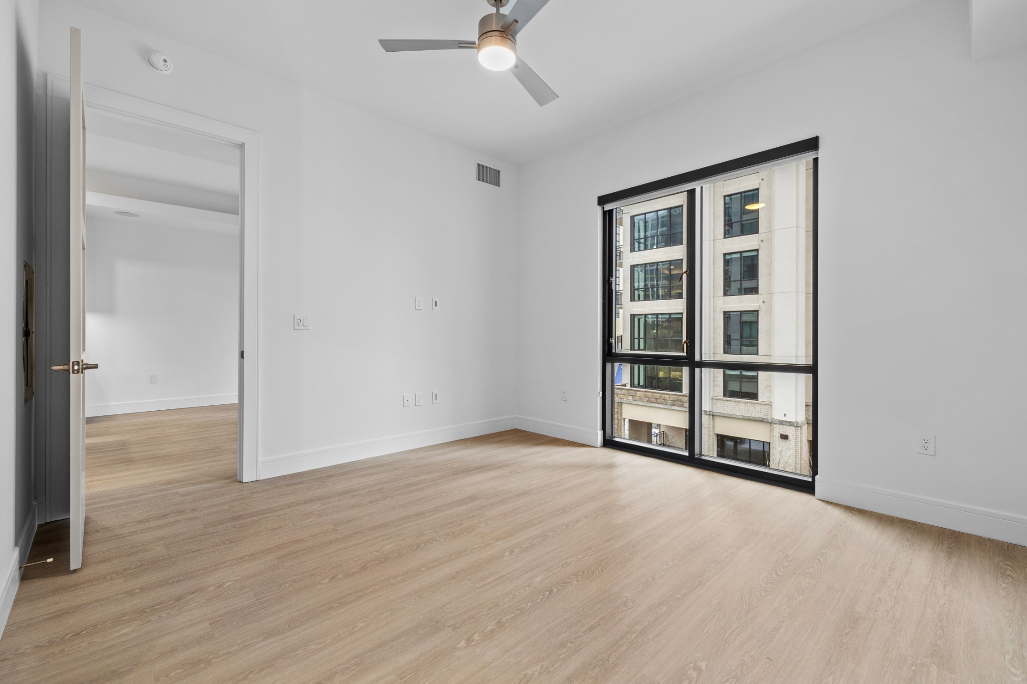 930 Commerce Street, Unit 508 Nashville, TN 37203 - Photo 20 of 65 wooden floor in an empty room with a window