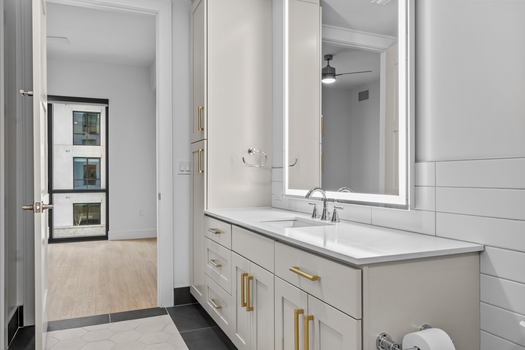 930 Commerce Street, Unit 508 Nashville, TN 37203 - Photo 22 of 65 a bathroom with a double vanity sink and a mirror