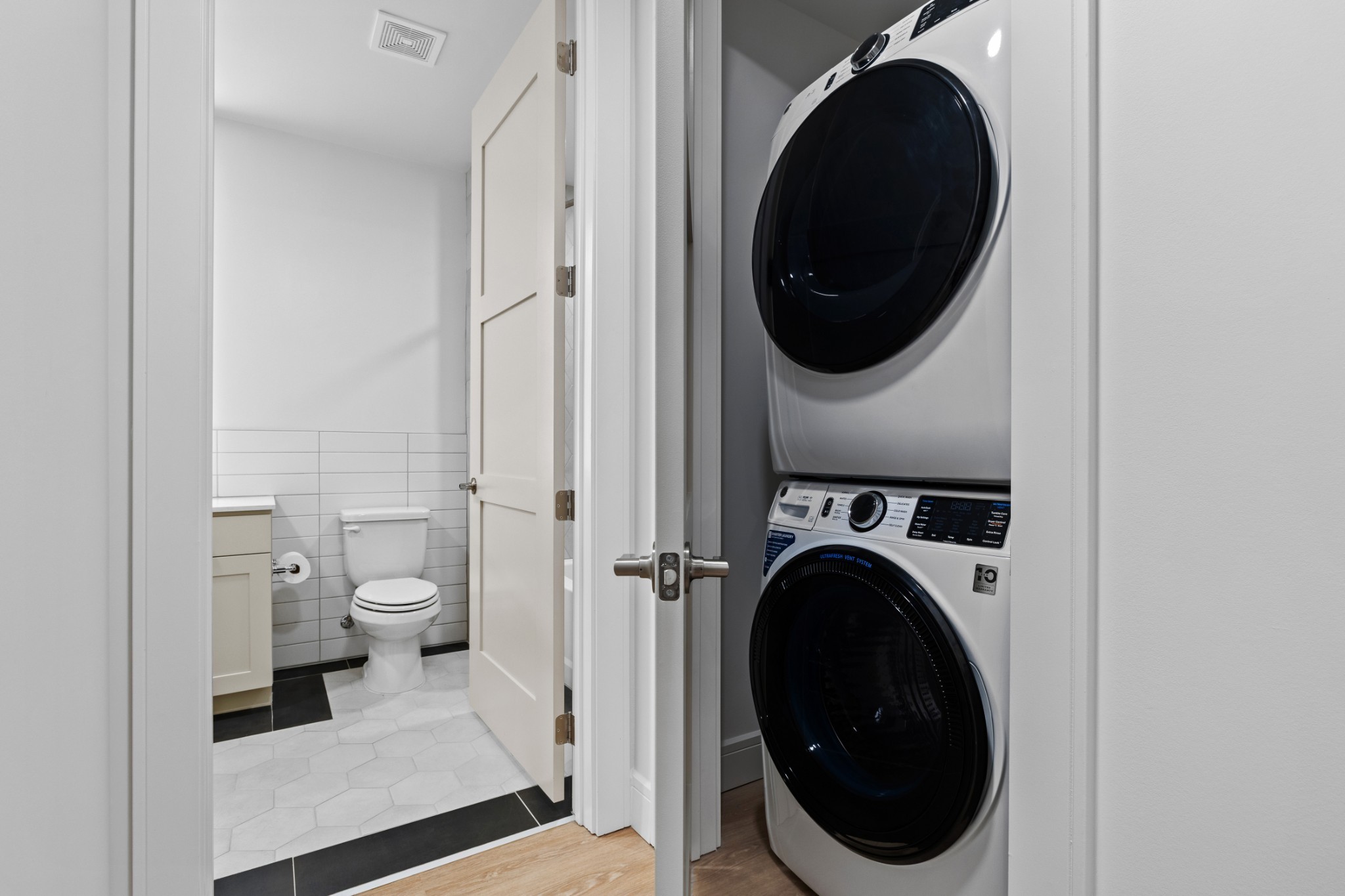 930 Commerce Street, Unit 508 Nashville, TN 37203 - Photo 27 of 65 a view of a bathroom with a washer and dryer