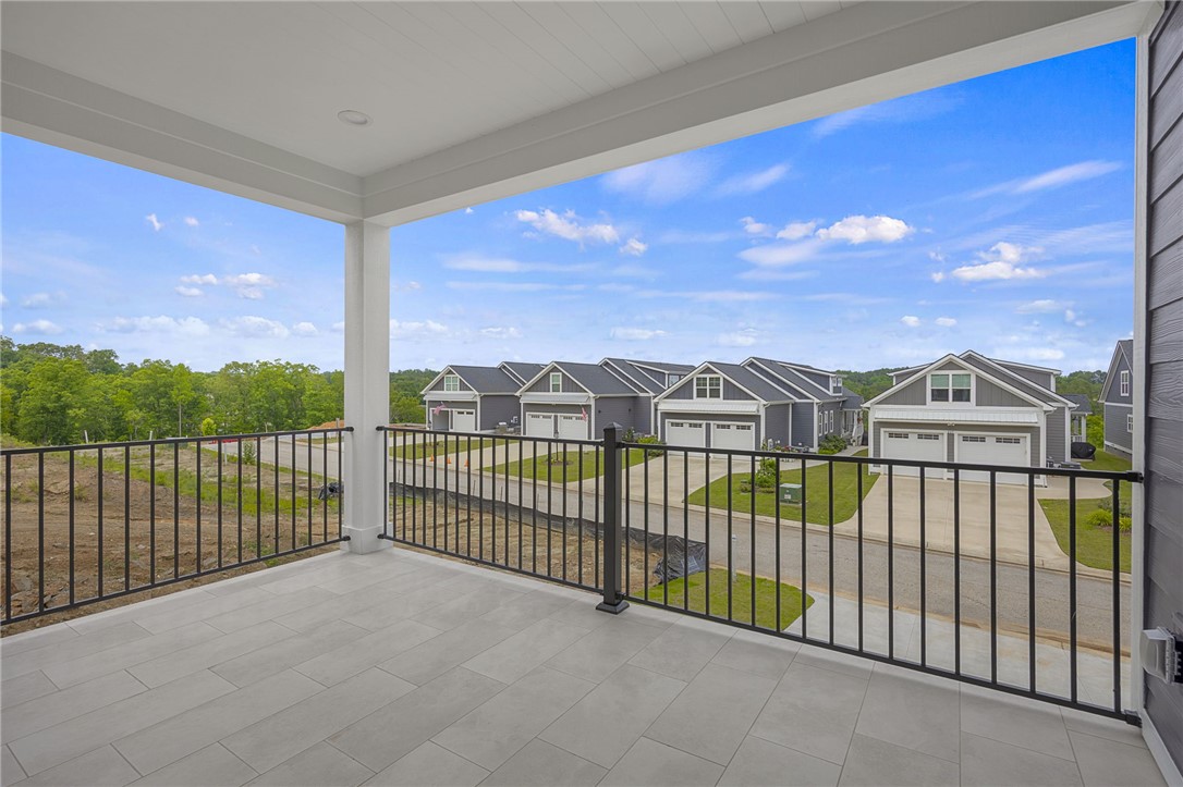 1230 Melton Road, Unit 216 West Union, SC 29696 - Photo 13 of 49 Enjoy peaceful views of the neighborhood from this inviting covered patio.