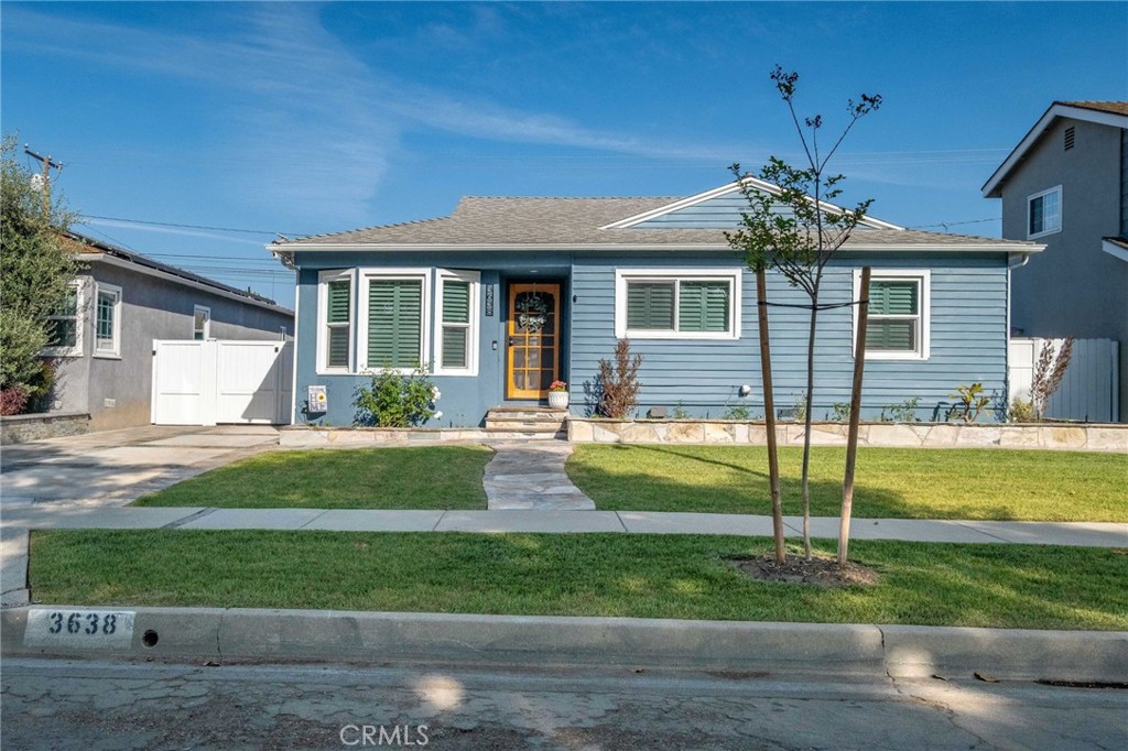 3638 North Studebaker Road Long Beach, CA 90808 - Photo 1 of 55 a front view of a house with a yard