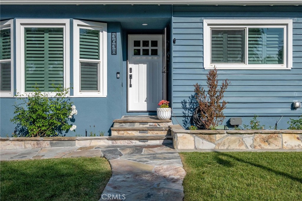 3638 North Studebaker Road Long Beach, CA 90808 - Photo 2 of 55 a front view of a house with a yard