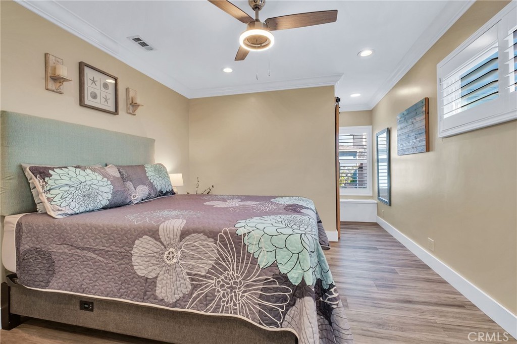 3638 North Studebaker Road Long Beach, CA 90808 - Photo 31 of 55 a bedroom with a bed and window