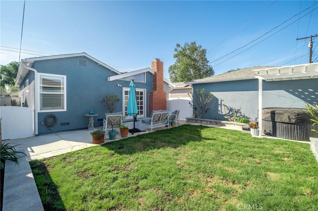3638 North Studebaker Road Long Beach, CA 90808 - Photo 41 of 55 a view of house with backyard and a patio