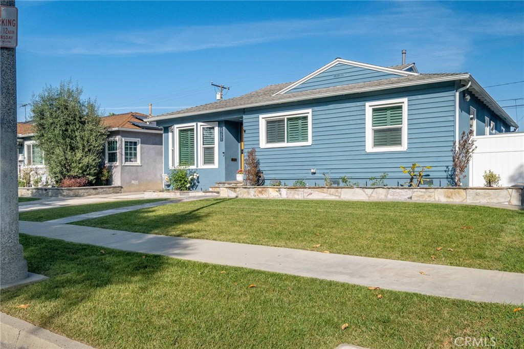 3638 North Studebaker Road Long Beach, CA 90808 - Photo 53 of 55 a front view of a house with a yard