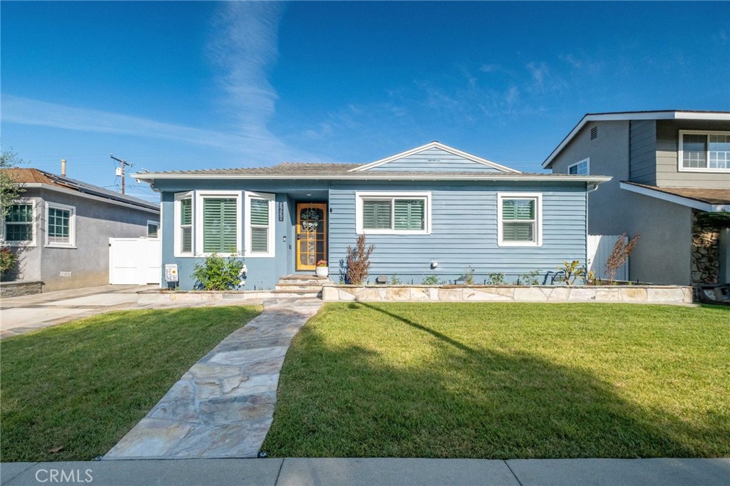 3638 North Studebaker Road Long Beach, CA 90808 - Photo 54 of 55 a front view of a house with yard and green space