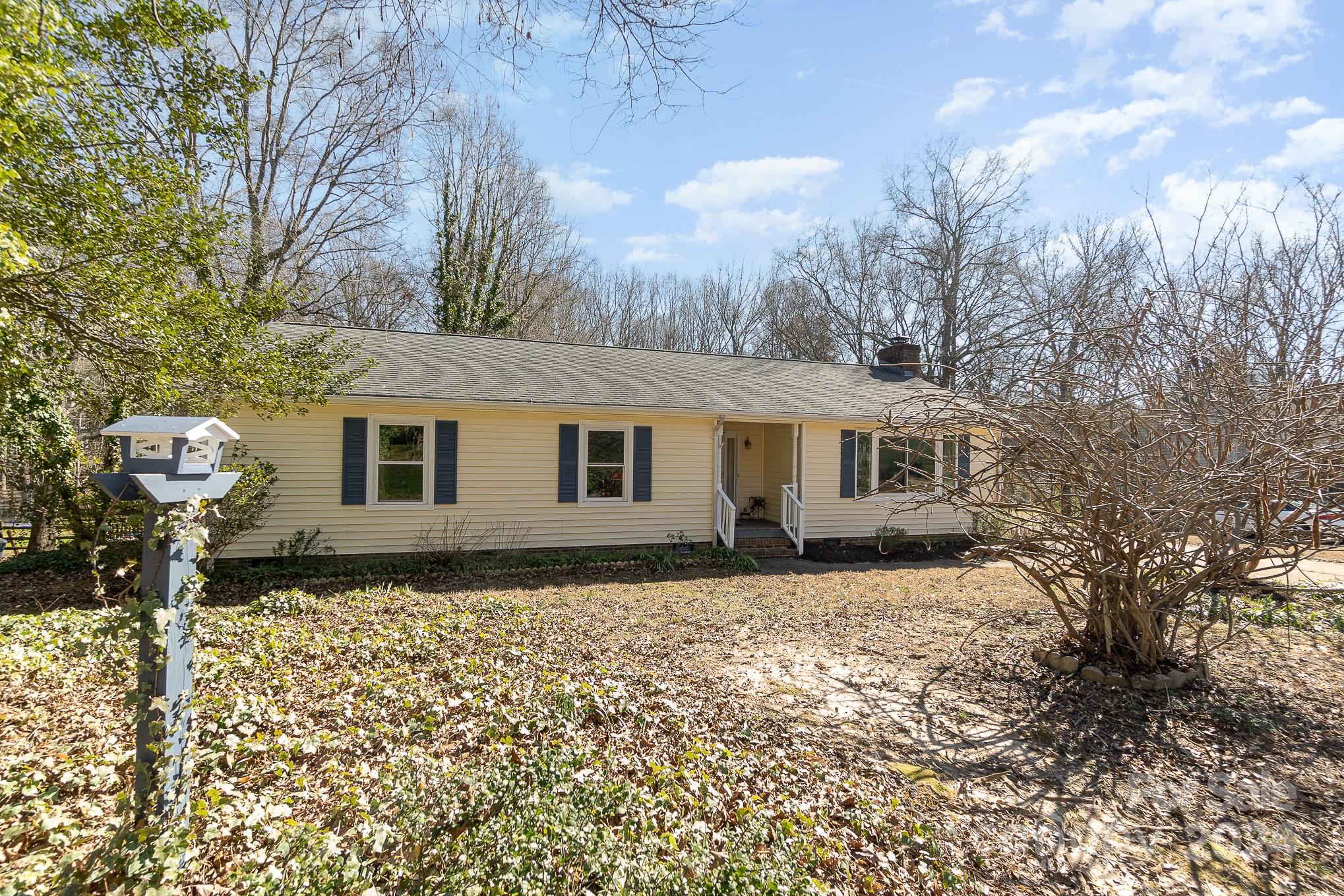 21014 Pine Ridge Drive Cornelius, NC 28031 - Photo 1 of 33 a front view of a house with a yard