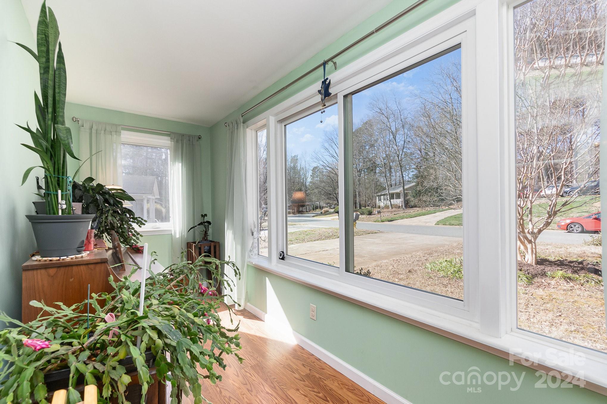 21014 Pine Ridge Drive Cornelius, NC 28031 - Photo 11 of 33 a room with chair and glass door