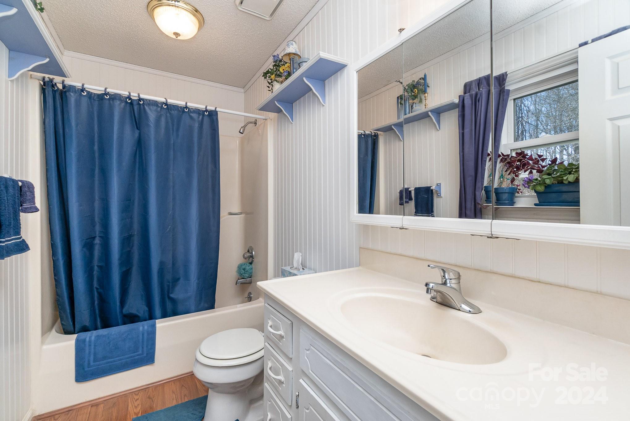 21014 Pine Ridge Drive Cornelius, NC 28031 - Photo 15 of 33 a bathroom with a sink toilet and shower