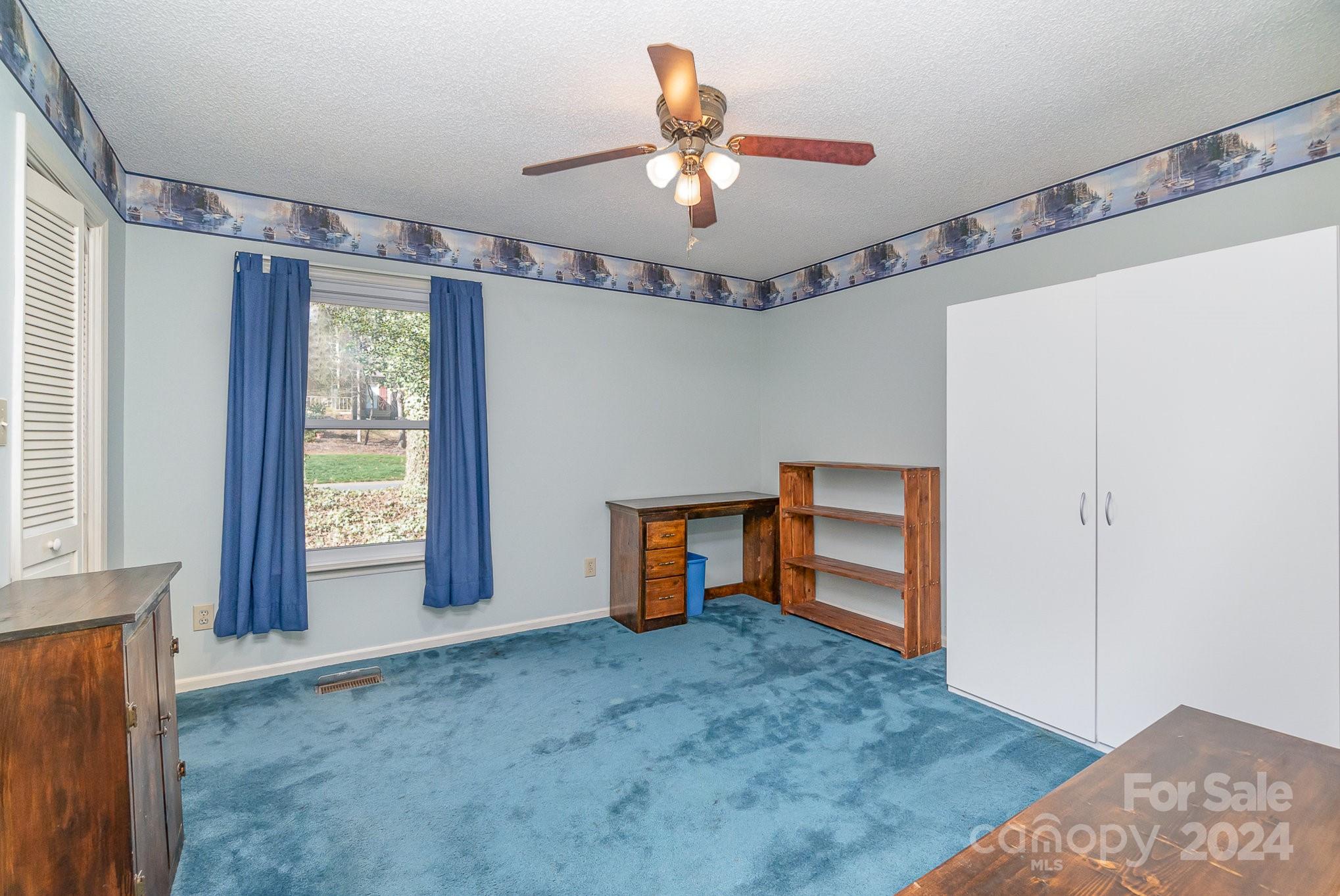 21014 Pine Ridge Drive Cornelius, NC 28031 - Photo 16 of 33 a view of an empty room with a window