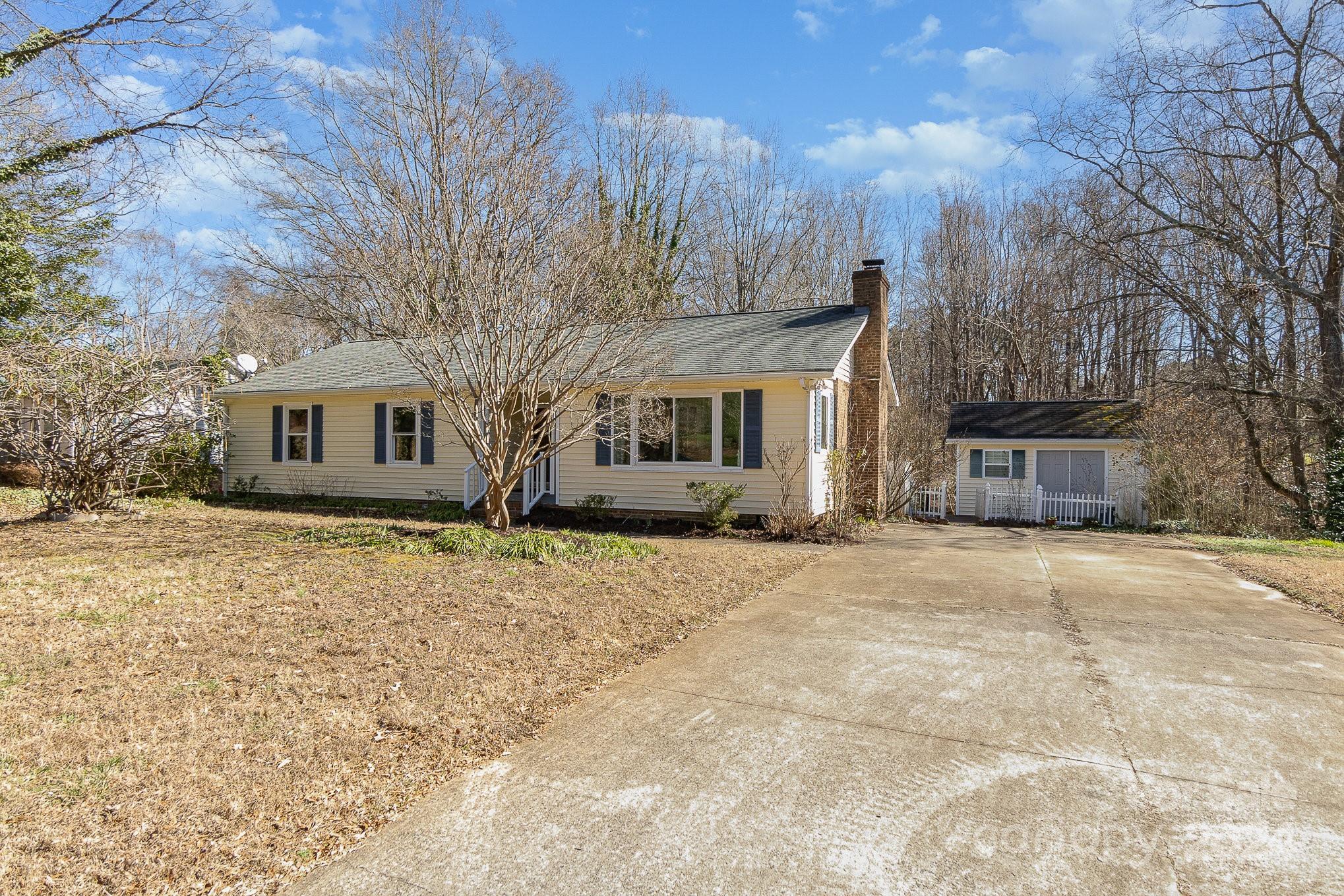 21014 Pine Ridge Drive Cornelius, NC 28031 - Photo 2 of 33 a front view of house with yard and trees around