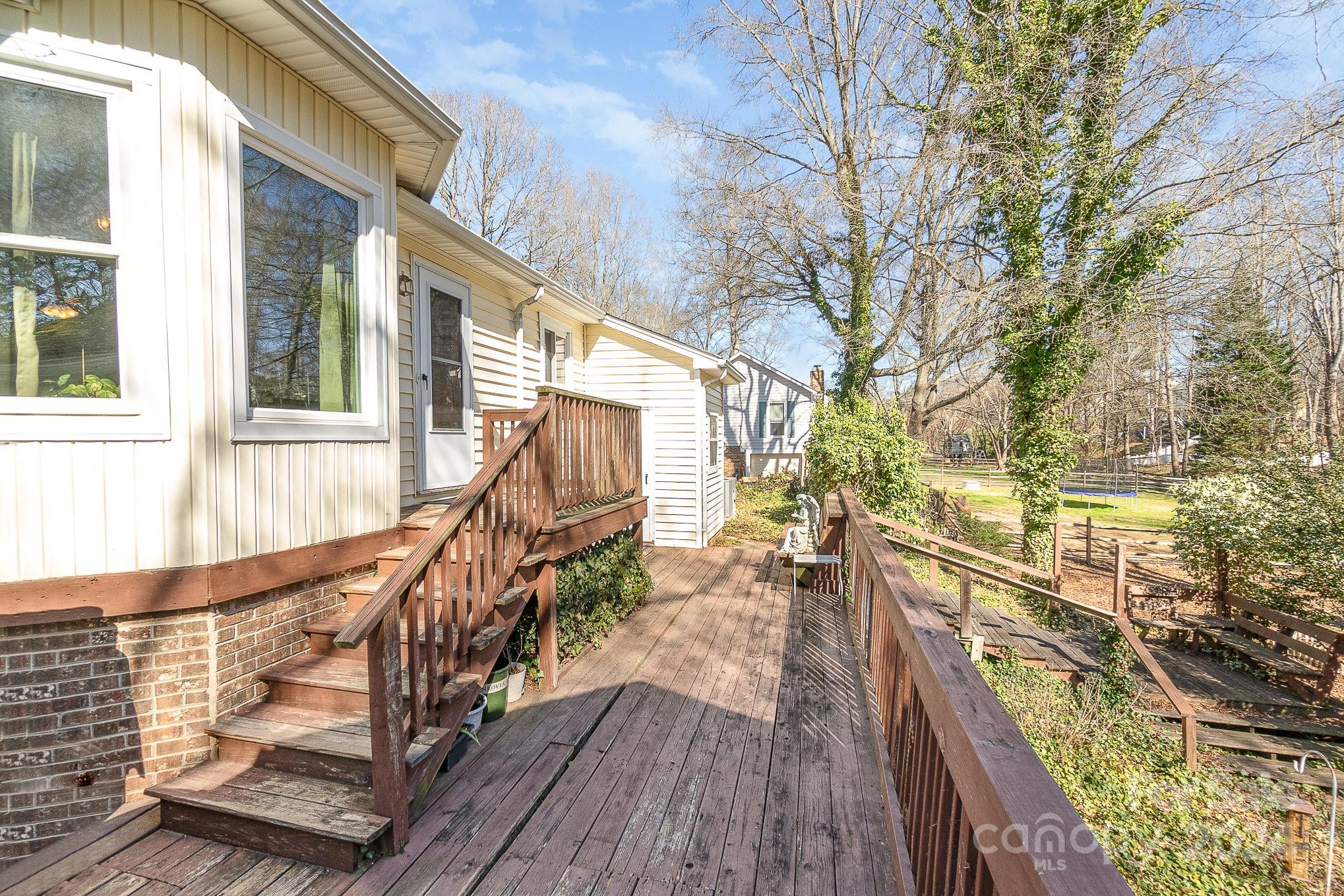21014 Pine Ridge Drive Cornelius, NC 28031 - Photo 22 of 33 a view of balcony with wooden floor and fence