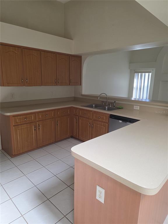 2790 Southwest 143 Place Road Ocala, FL 34473 - Photo 2 of 6 a kitchen with stainless steel appliances a sink a stove with cabinets