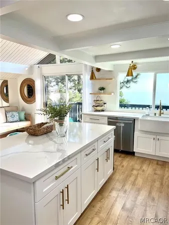 a kitchen with a sink and a stove top oven