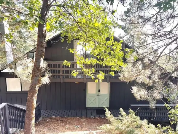 a view of a backyard of the house