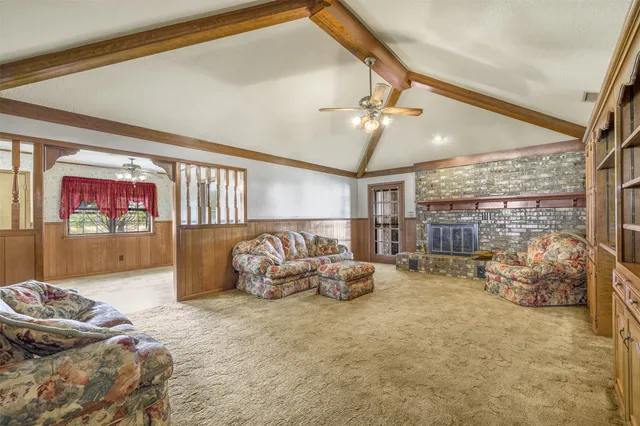 a bedroom with furniture and a ceiling fan
