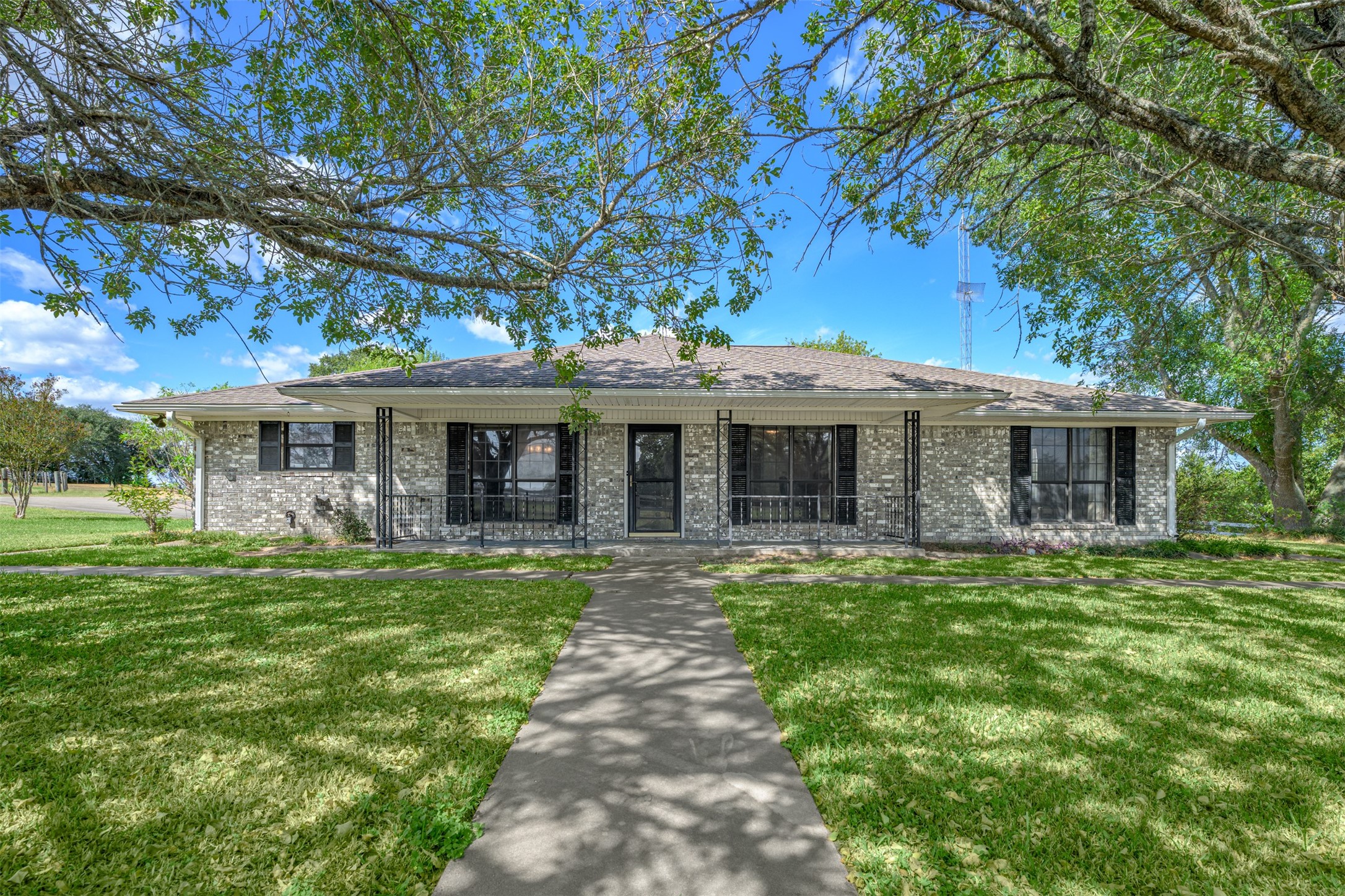 6700 FM 332 Road Brenham, TX 77833 - Photo 3 of 36 a front view of a house with a garden