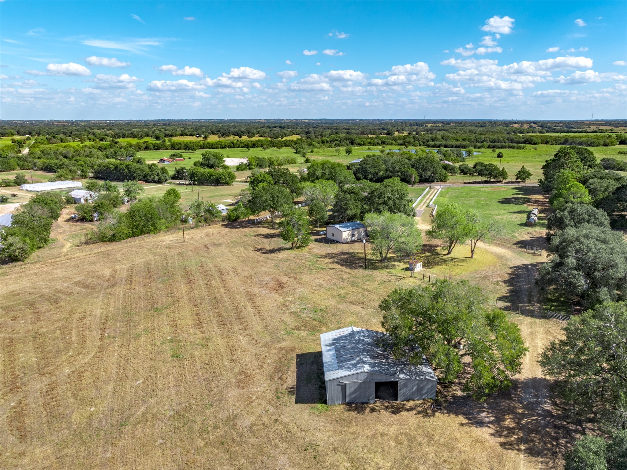 6700 FM 332 Road Brenham, TX 77833 - Photo 32 of 36 a view of a backyard of a house