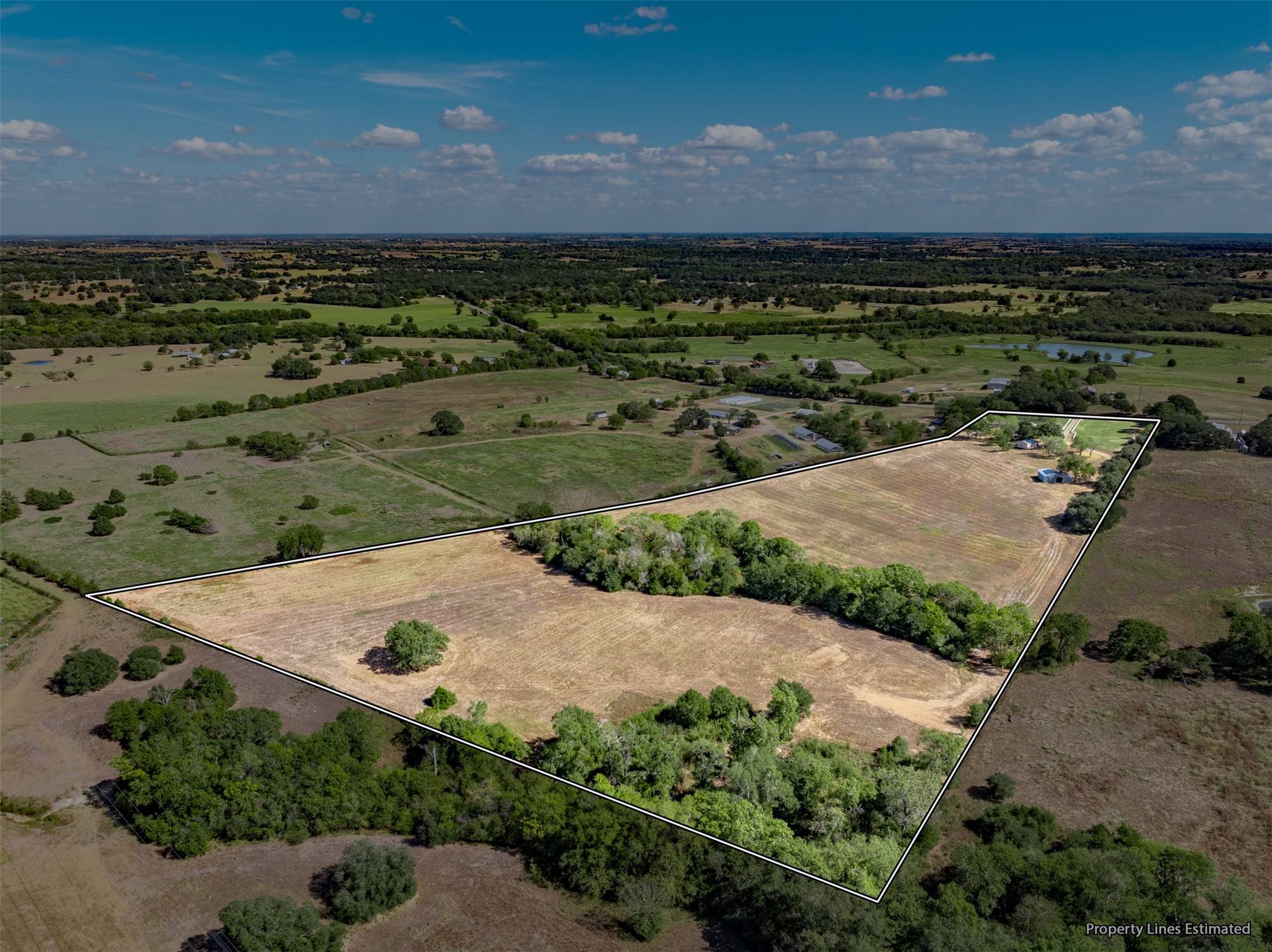6700 FM 332 Road Brenham, TX 77833 - Photo 35 of 36 an aerial view of a house with a yard