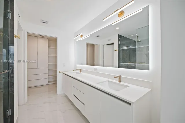a bathroom with a double vanity sink mirror and double