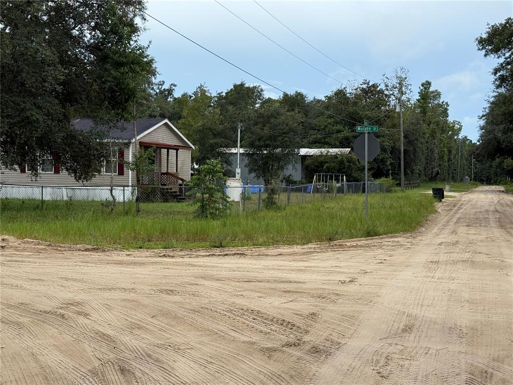 106 Jackson Avenue Interlachen, FL 32148 - Photo 21 of 27 a view of a house with a swimming pool
