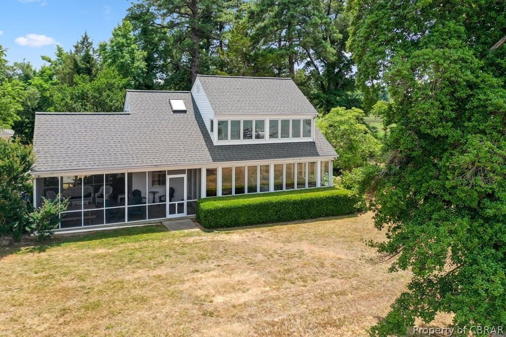 1 Cabin Road Lottsburg, VA 22511 - Photo 4 of 50 Back of property with a sunroom and a lawn