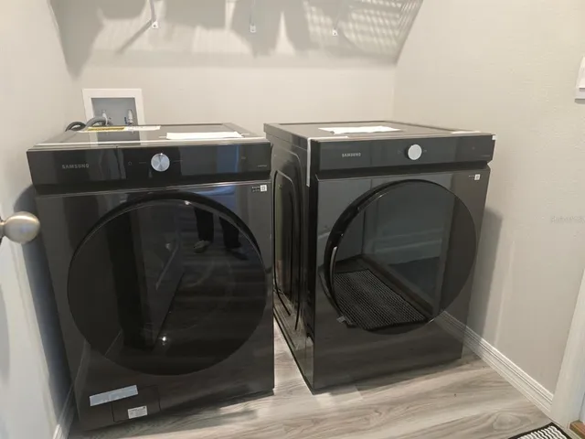 a utility room with dryer and washer