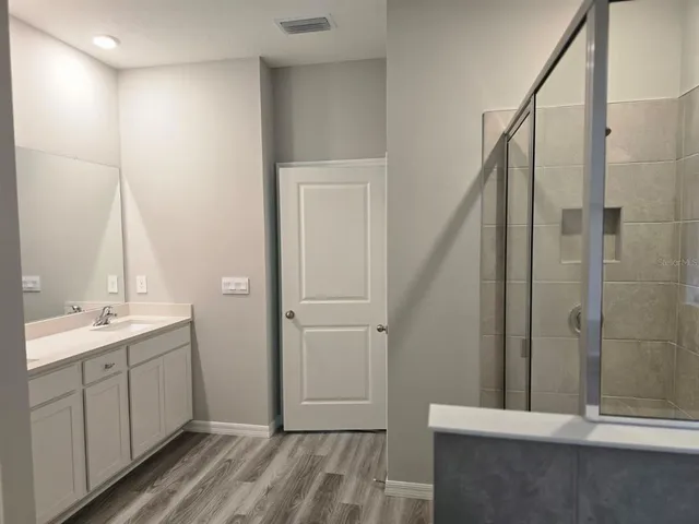 a bathroom with a bathtub and a shower