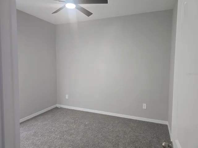 an empty room with a empty space and a window