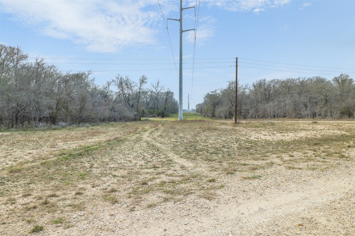 1144 Treetop Lane Luling, TX 78648 - Photo 11 of 31 a view of a dry yard with trees