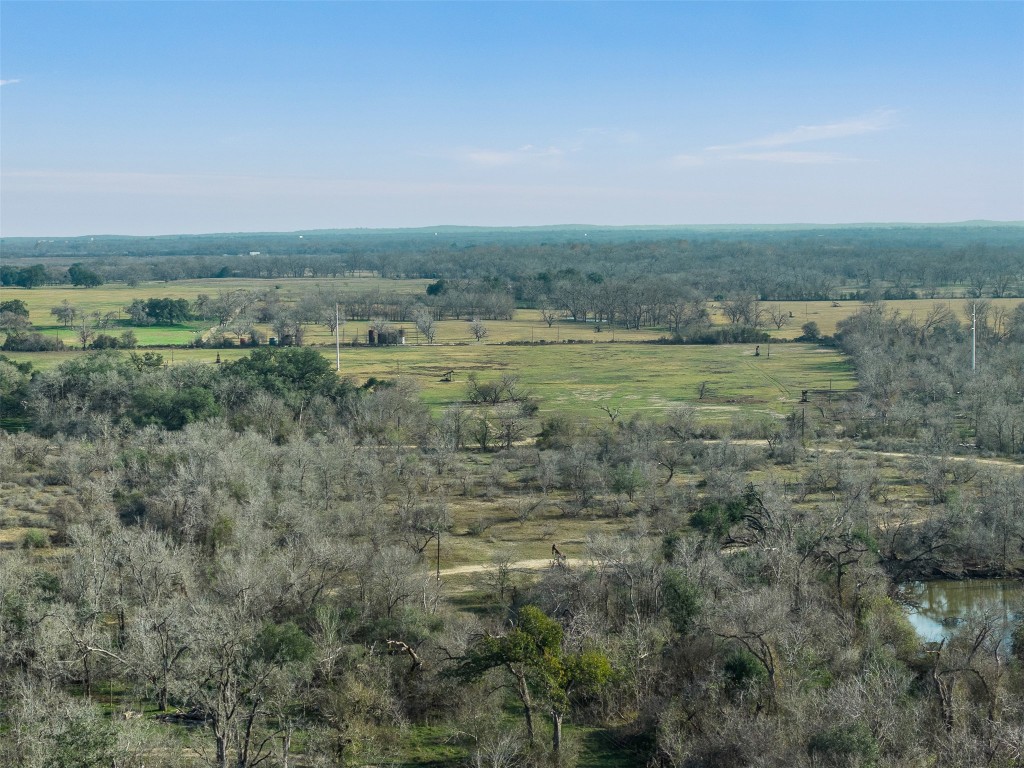 1144 Treetop Lane Luling, TX 78648 - Photo 18 of 31 a view of a field with trees in background