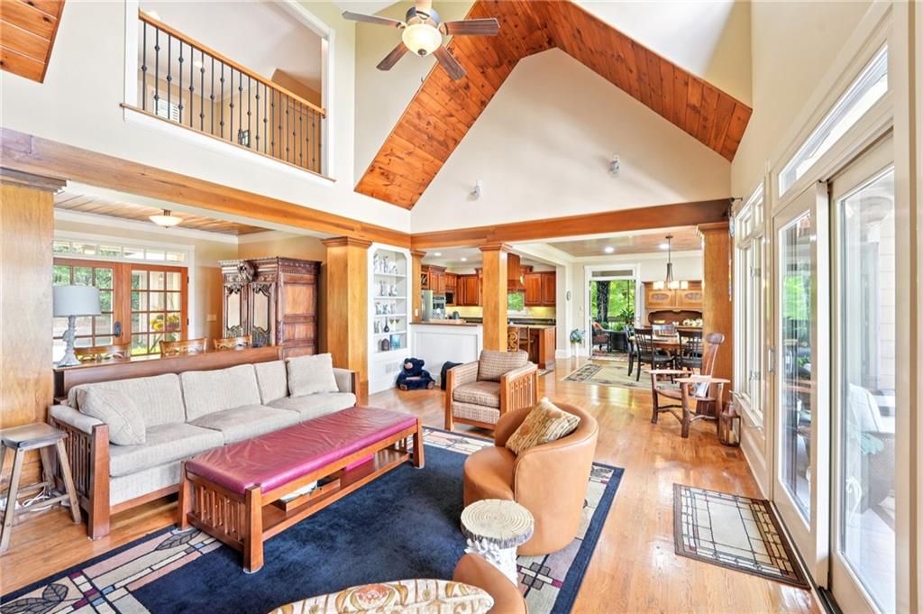 44 Sassafras Ridge Big Canoe, GA 30143 - Photo 12 of 107 a living room with furniture a rug and a large window