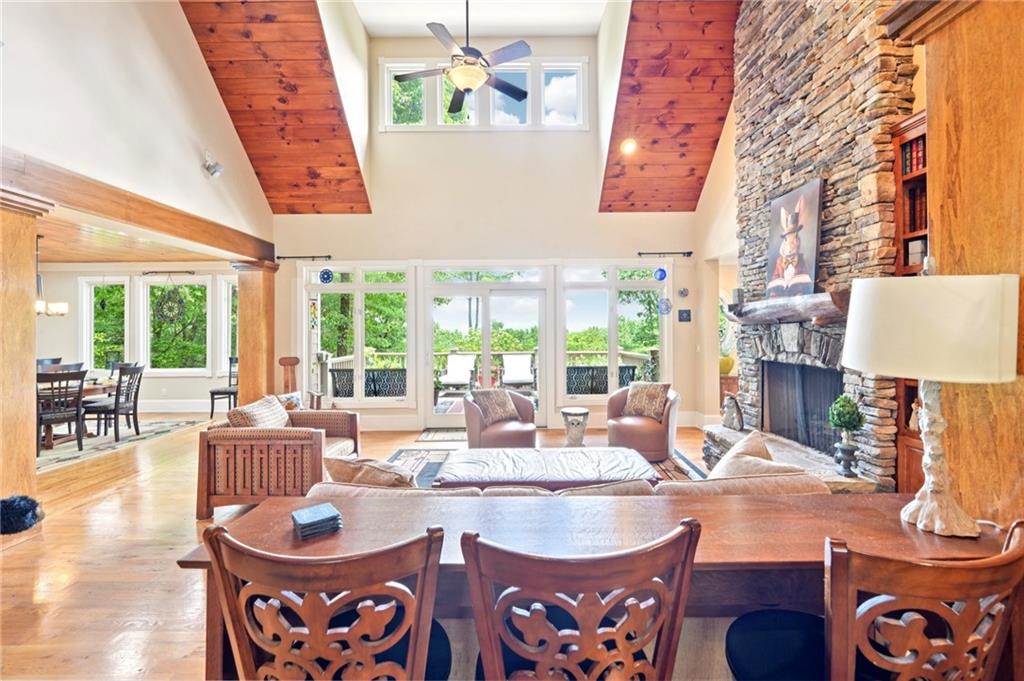 44 Sassafras Ridge Big Canoe, GA 30143 - Photo 14 of 107 a dining room with furniture a large window and a chandelier