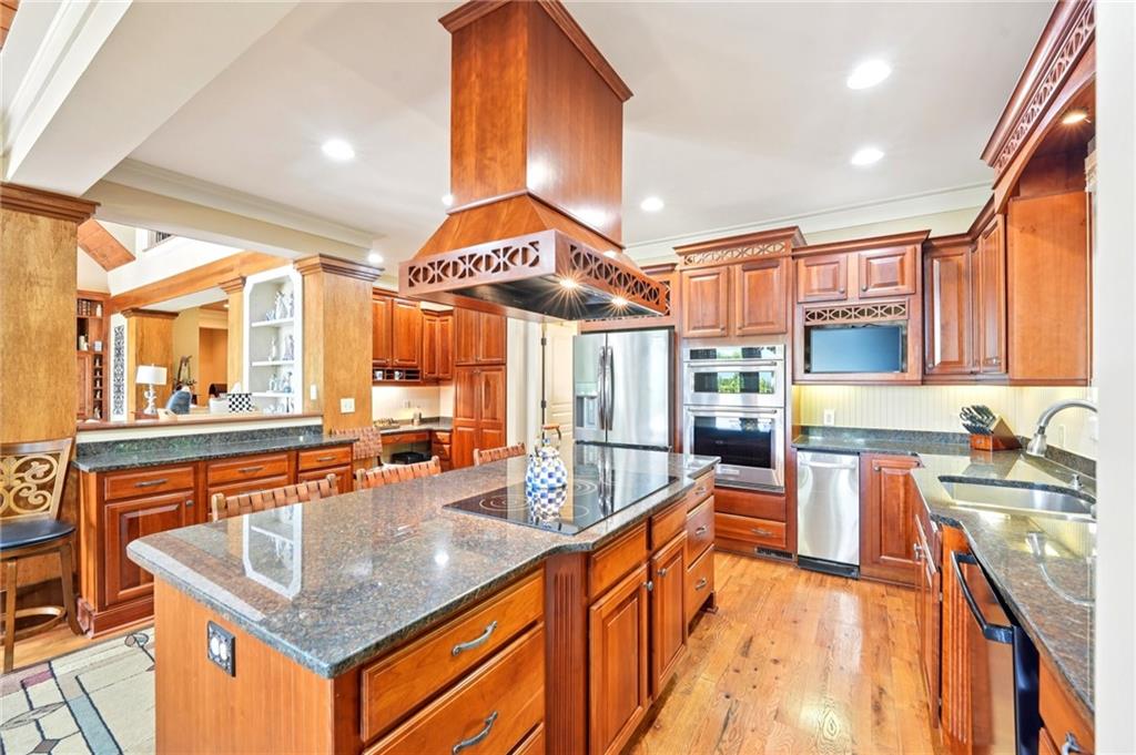 44 Sassafras Ridge Big Canoe, GA 30143 - Photo 19 of 107 a kitchen with stainless steel appliances granite countertop counter space a sink and cabinets