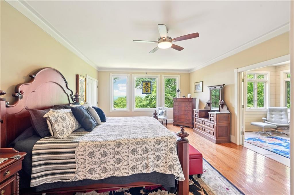 44 Sassafras Ridge Big Canoe, GA 30143 - Photo 33 of 107 a bedroom with a bed and wooden floor
