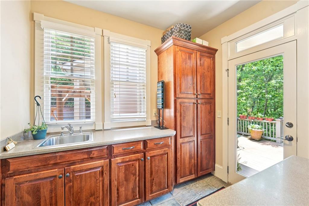44 Sassafras Ridge Big Canoe, GA 30143 - Photo 53 of 107 a bathroom with a sink and a large mirror