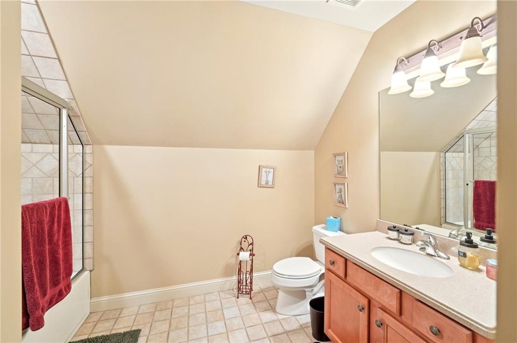 44 Sassafras Ridge Big Canoe, GA 30143 - Photo 61 of 107 a bathroom with a sink a toilet and a mirror