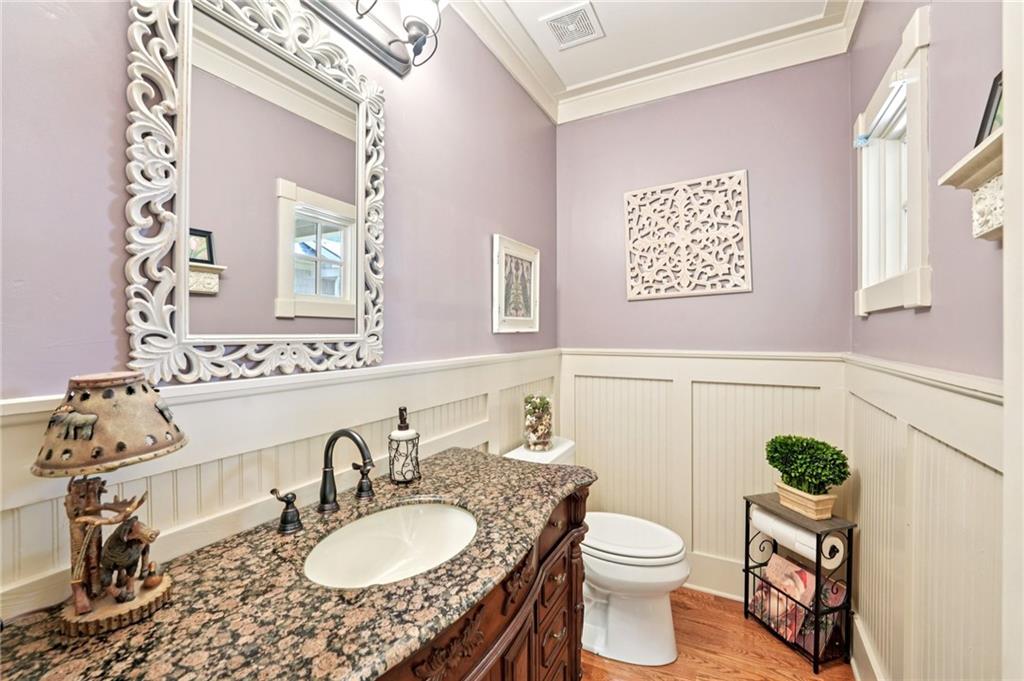 44 Sassafras Ridge Big Canoe, GA 30143 - Photo 67 of 107 a bathroom with a granite countertop toilet a sink and a mirror
