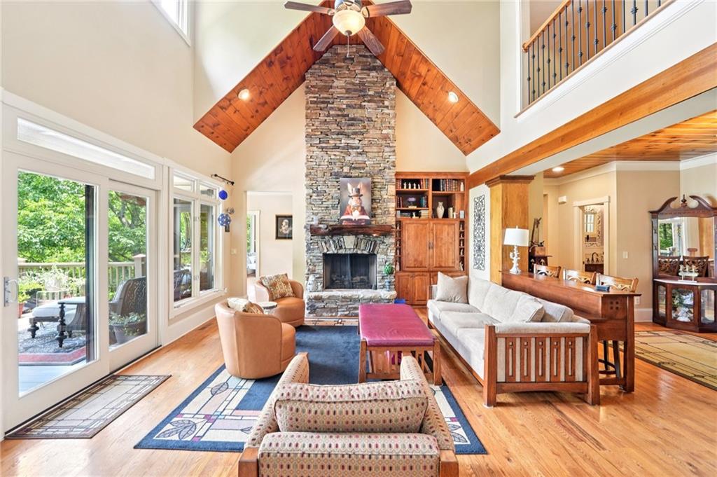 44 Sassafras Ridge Big Canoe, GA 30143 - Photo 10 of 107 a living room with fireplace furniture and a wooden floor