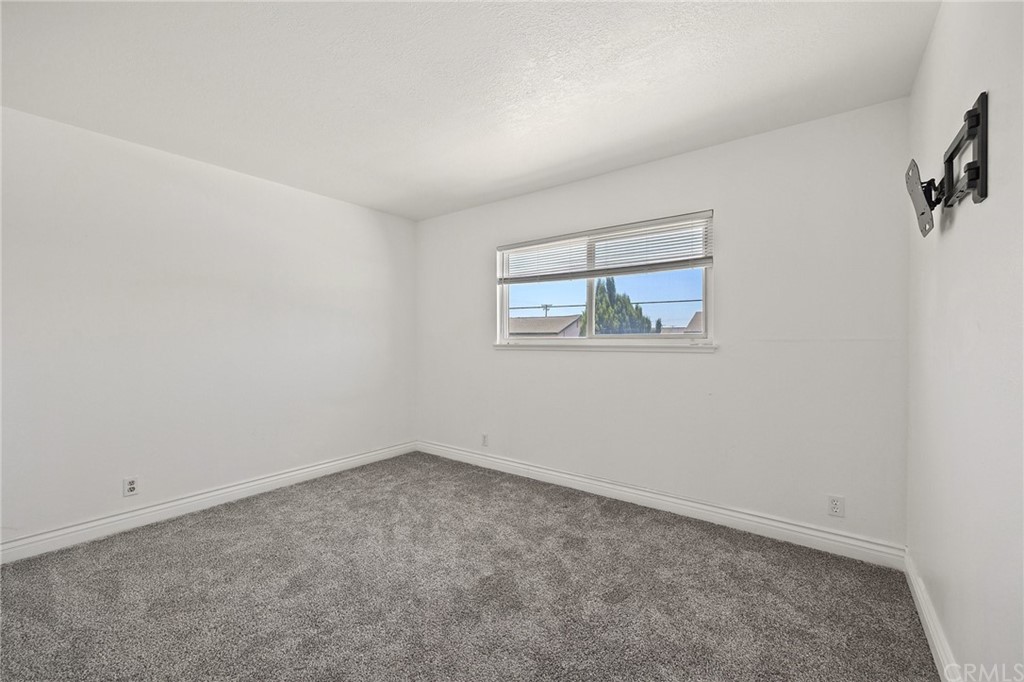 10221 Beaver Circle Cypress, CA 90630 - Photo 13 of 26 an empty room with a window