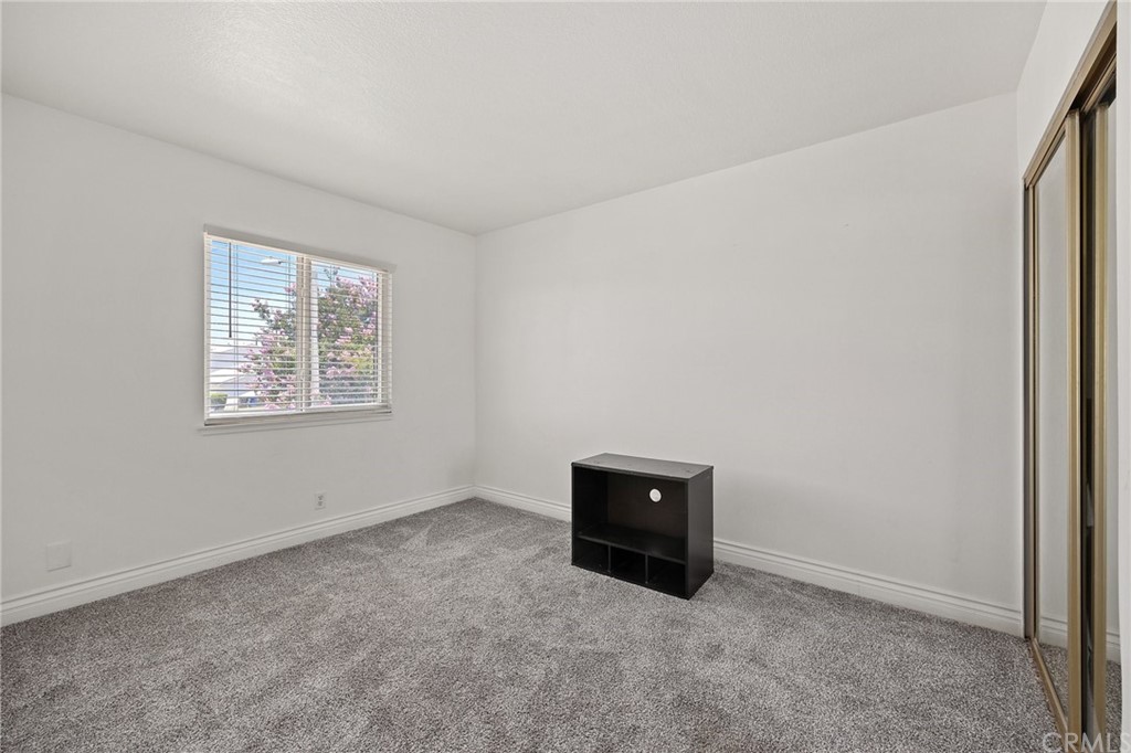 10221 Beaver Circle Cypress, CA 90630 - Photo 14 of 26 an empty room with windows