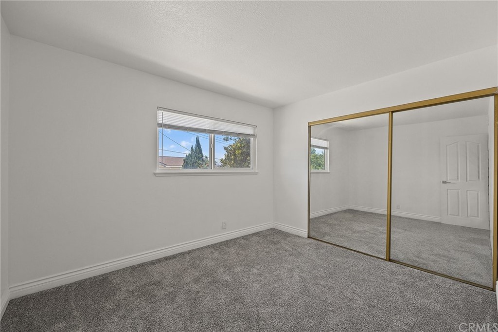 10221 Beaver Circle Cypress, CA 90630 - Photo 15 of 26 an empty room with a empty space and window