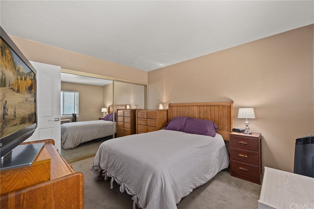 10221 Beaver Circle Cypress, CA 90630 - Photo 16 of 26 a bedroom with two beds and a couch