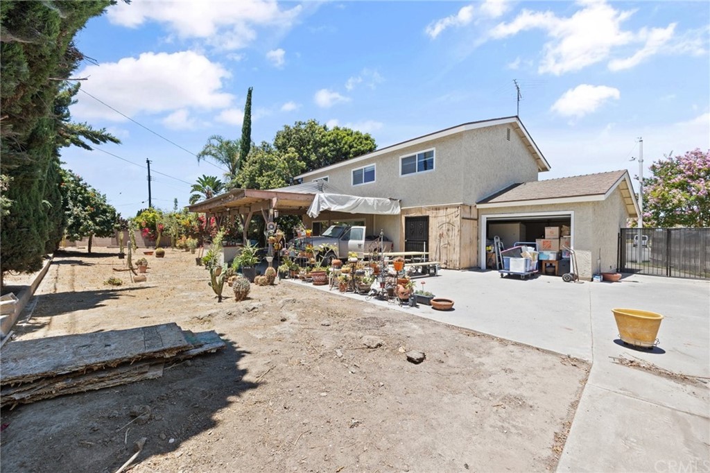 10221 Beaver Circle Cypress, CA 90630 - Photo 22 of 26 a view of a yard with sitting area