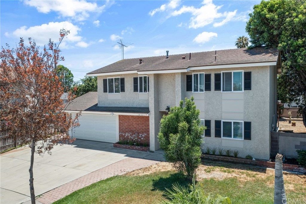10221 Beaver Circle Cypress, CA 90630 - Photo 26 of 26 a front view of a house with a yard