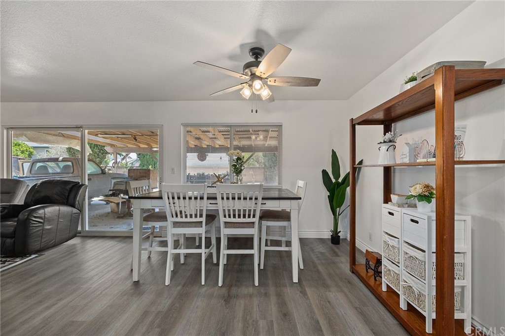 10221 Beaver Circle Cypress, CA 90630 - Photo 8 of 26 a view of a dining room with furniture window and wooden floor