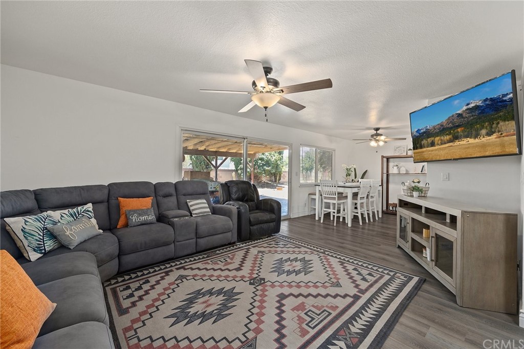 10221 Beaver Circle Cypress, CA 90630 - Photo 9 of 26 a living room with furniture a flat screen tv and a rug